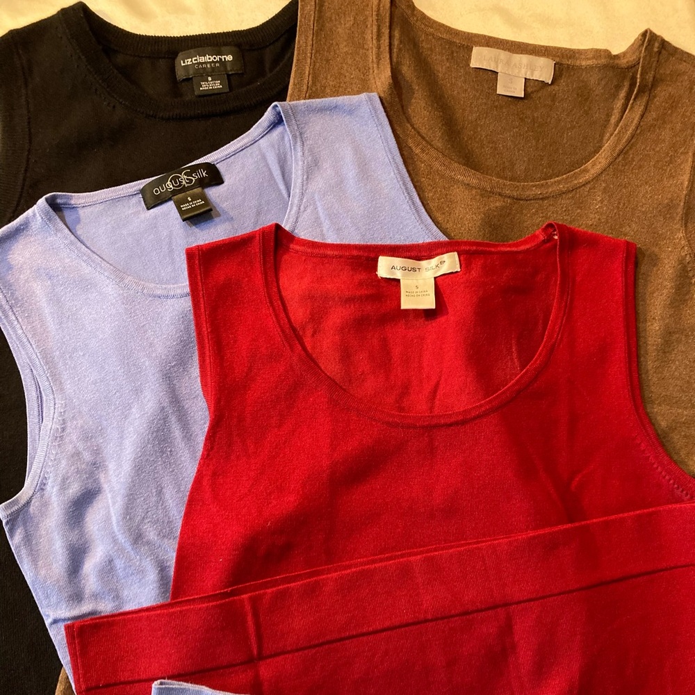Four soft designer sleeveless Shell sweaters, mint condition, all size small!
